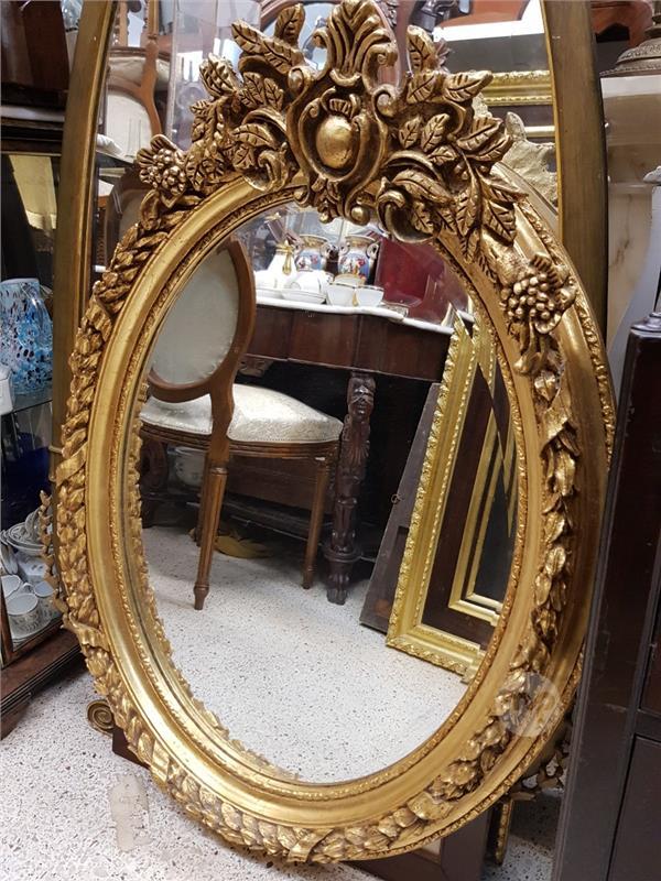 Oval gilded mirror,105 x 75 cms. Maltapark